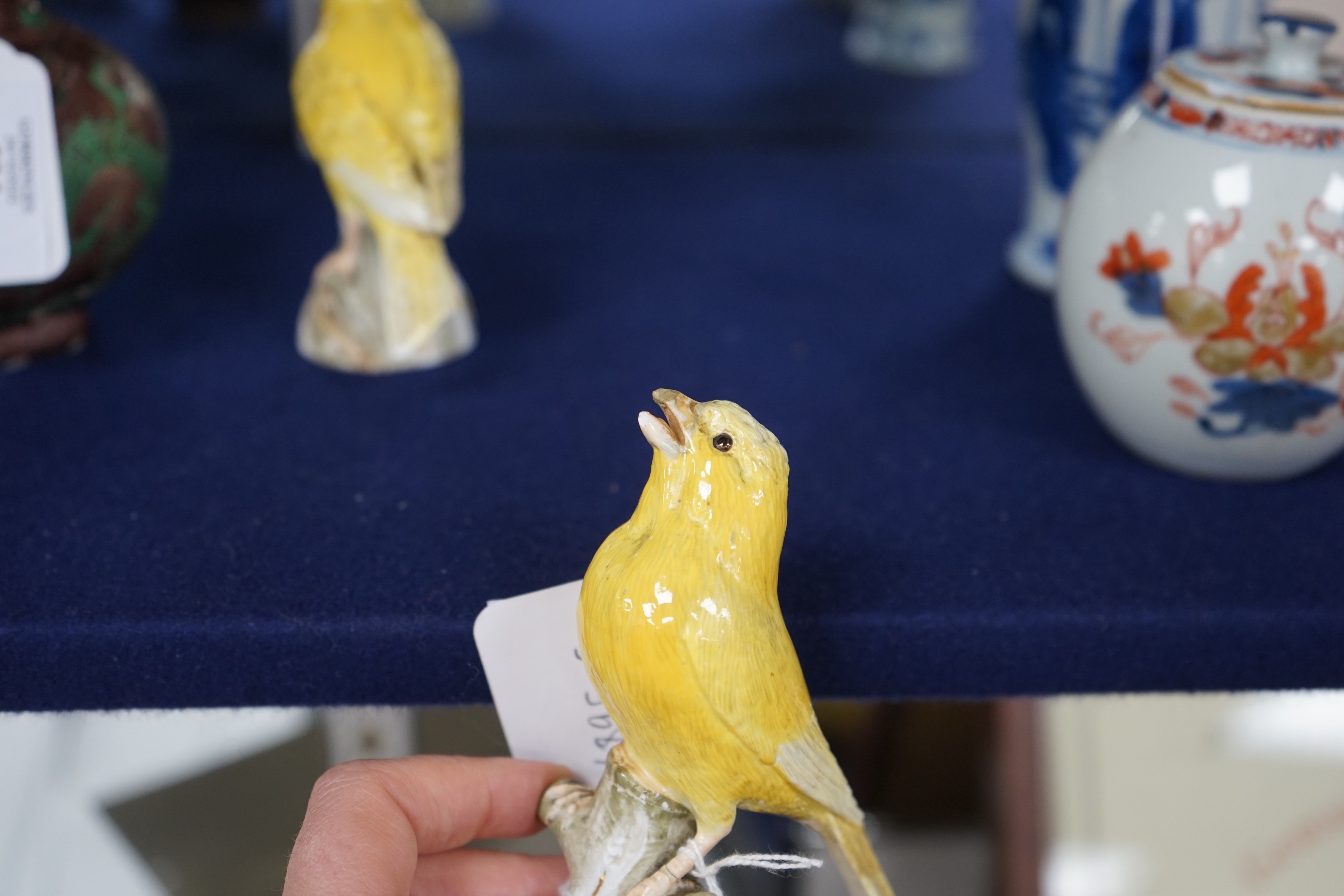 A pair of Meissen figures of canaries, 10cm tall
